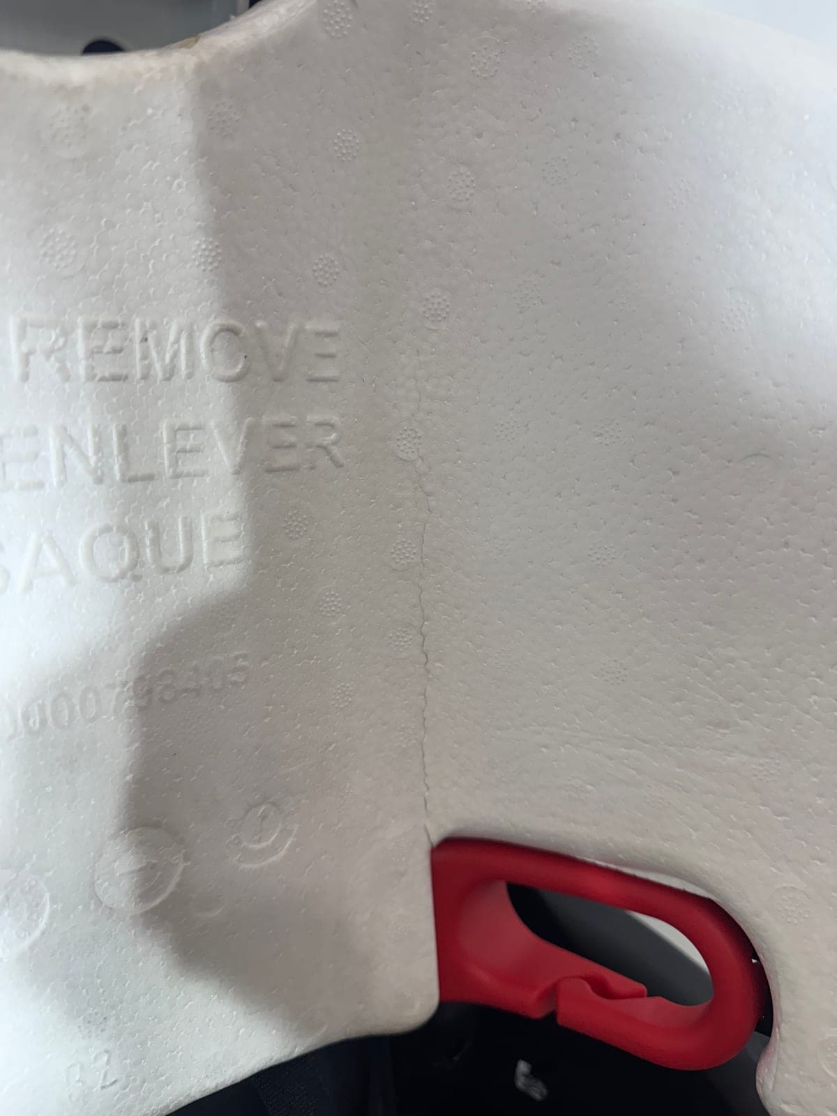 Close-up of a thin hairline crack in car seat foam